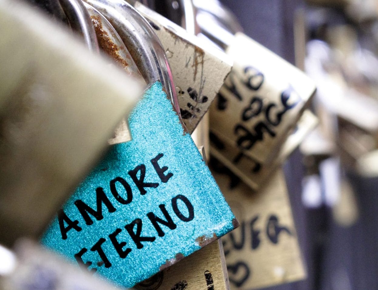 Can you sit on the Spanish Steps? SHould you add a love lock to a bridge. A photo showing mutliple padlocks with love messages written on them that have been attached to a bridge or railing. Another activity banned in various tourism locations.