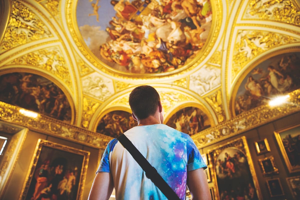 student staring at ceiling inside an Italian museum Florence