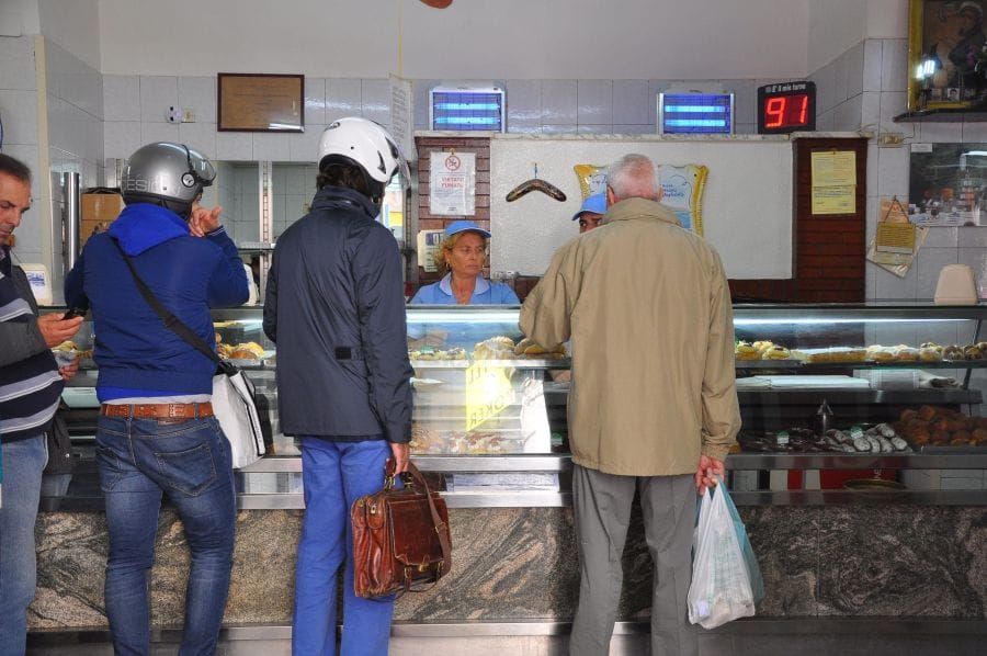 Pasticceria Attanasio, where you can get great sfogliatelle in Naples A queue of people wait at the counter to be served in the bakery, Pasticceria Attanasio, where the nest sfogliatelle is made in Naples