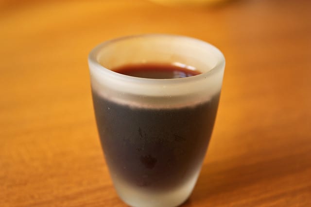 Shot of mirto at a restaurant in Italy