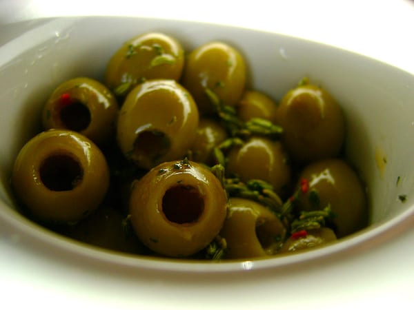 Nothing like olives drizzled in delicious olive oil! Photo by CeresB (flickr)