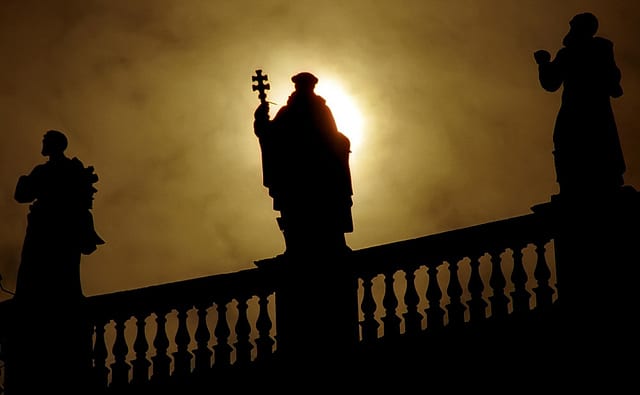 The silhouette of a saint The Piazza San Pietro, a testament to the history and power of Vatican City and its Basilica. Photo by David Ohmer