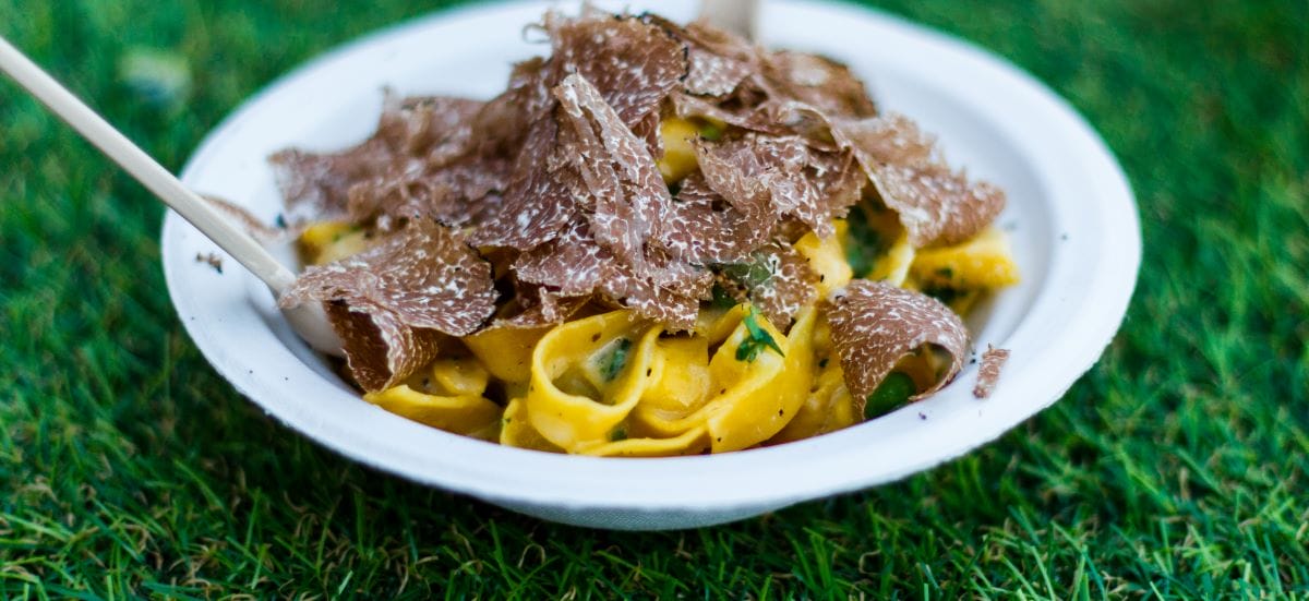 Truffles shaved on top of a plate of pasta