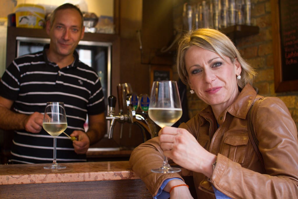 a couple enjoying a glass of white wine in Venice