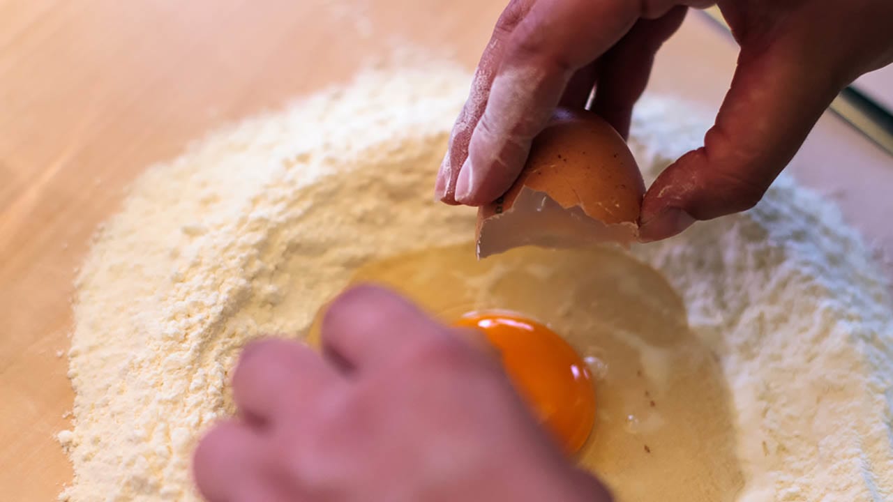 Crack the eggs into your little flour volcano!