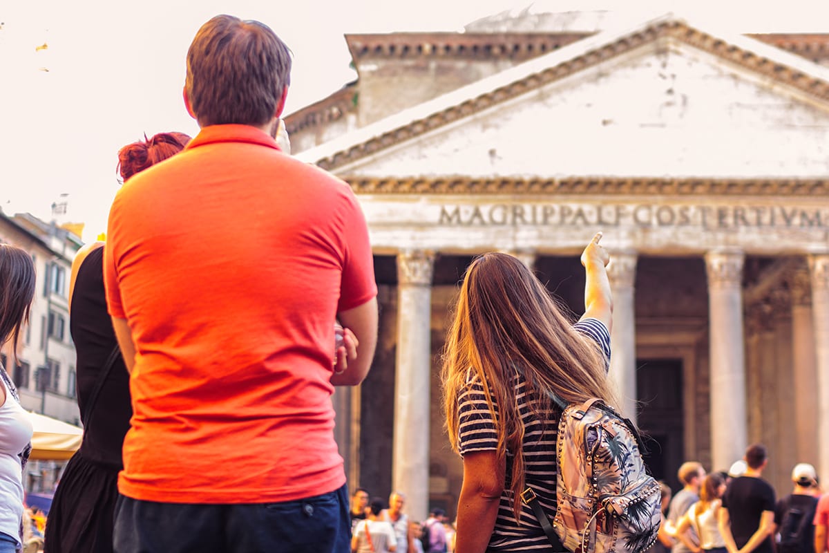 Tour guide leading group in front of Rome's Pantheon