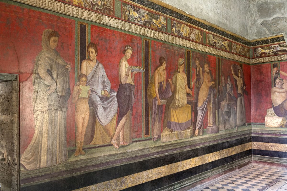 A vibrant Pompeii wall painting depicting various figures.