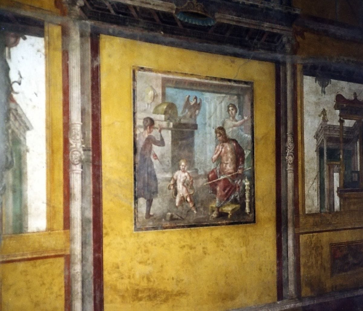 Colorful Pompeii wall painting of Hercules as a child found in the Casa dei Vettii.