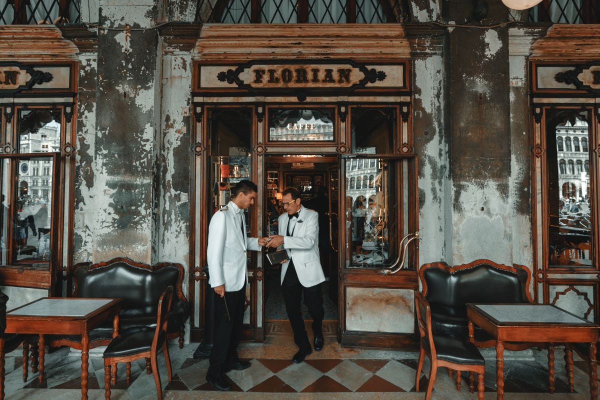 Two waiters outside of Caffè Florian in Venice. 