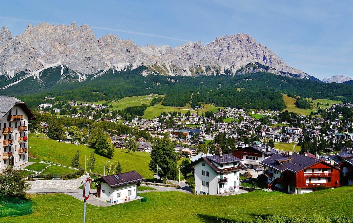 Small town Cortina d'Ampezzo mountains and blue sky
