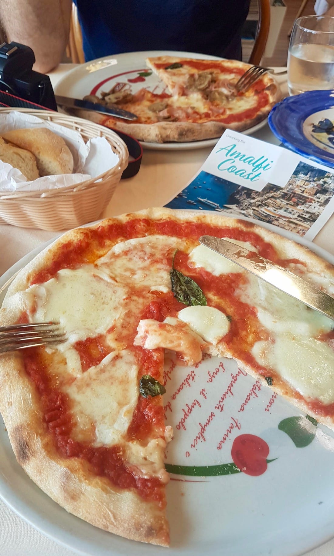 Two margharita pizzas on a restaurant table during a Rome to Amalfi Coast day trip with Walks