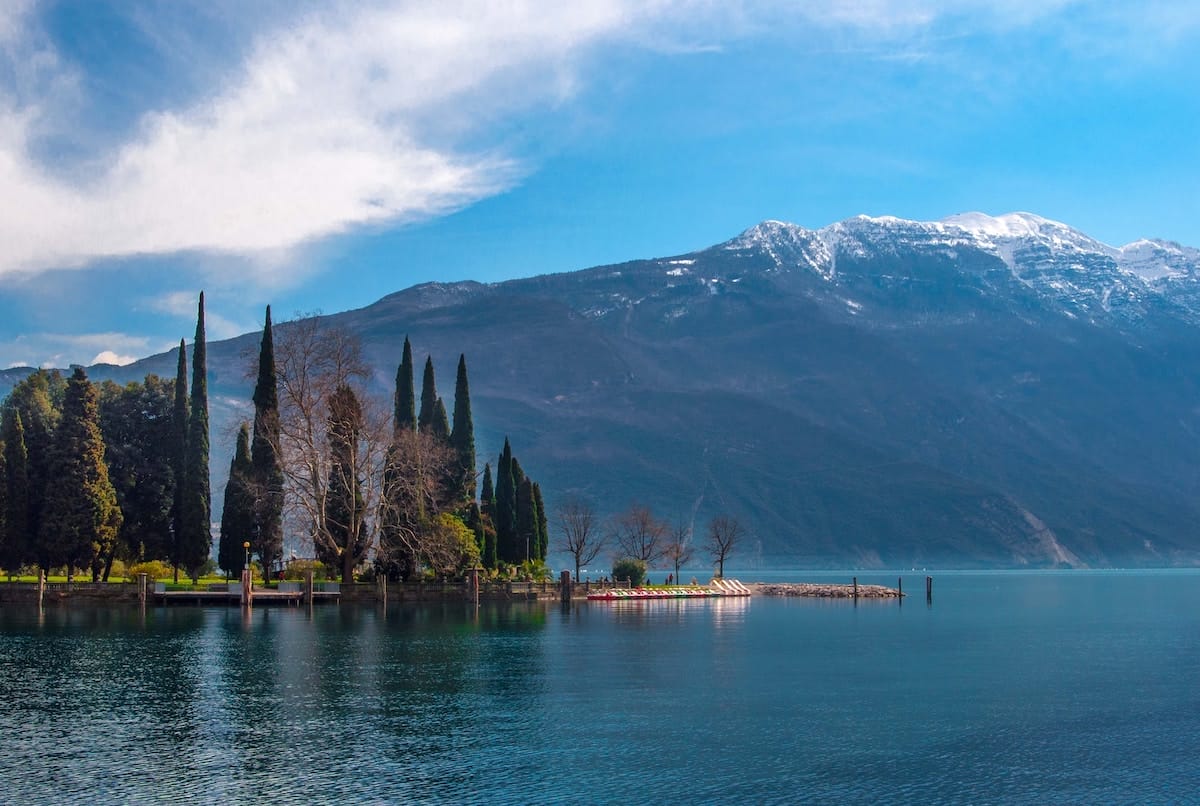 lago di garda body of water mountains blue sky