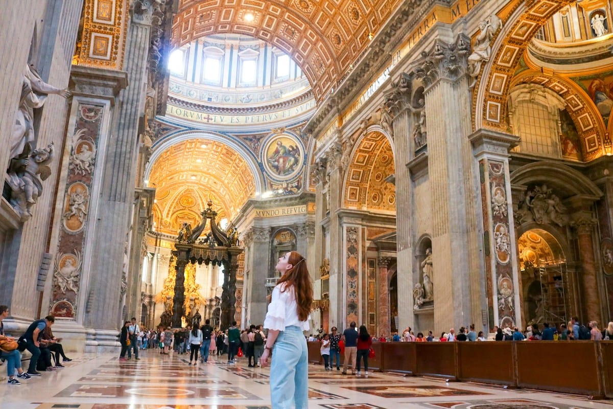 Woman in summer clothes inside St. Peter's Basilica, Vatican City