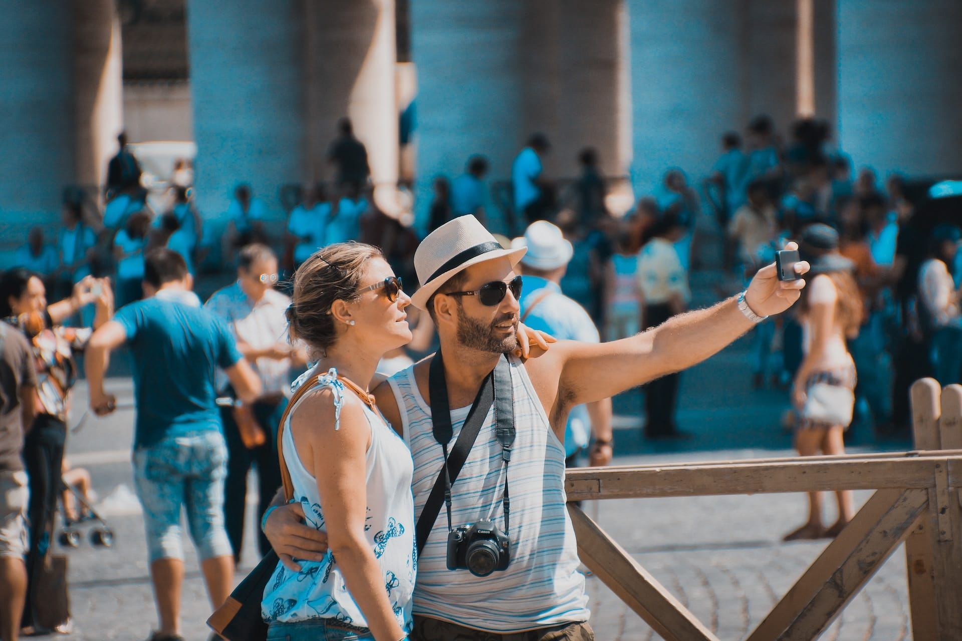 Couple taking picture during summer in Italy not following Vatican dress code