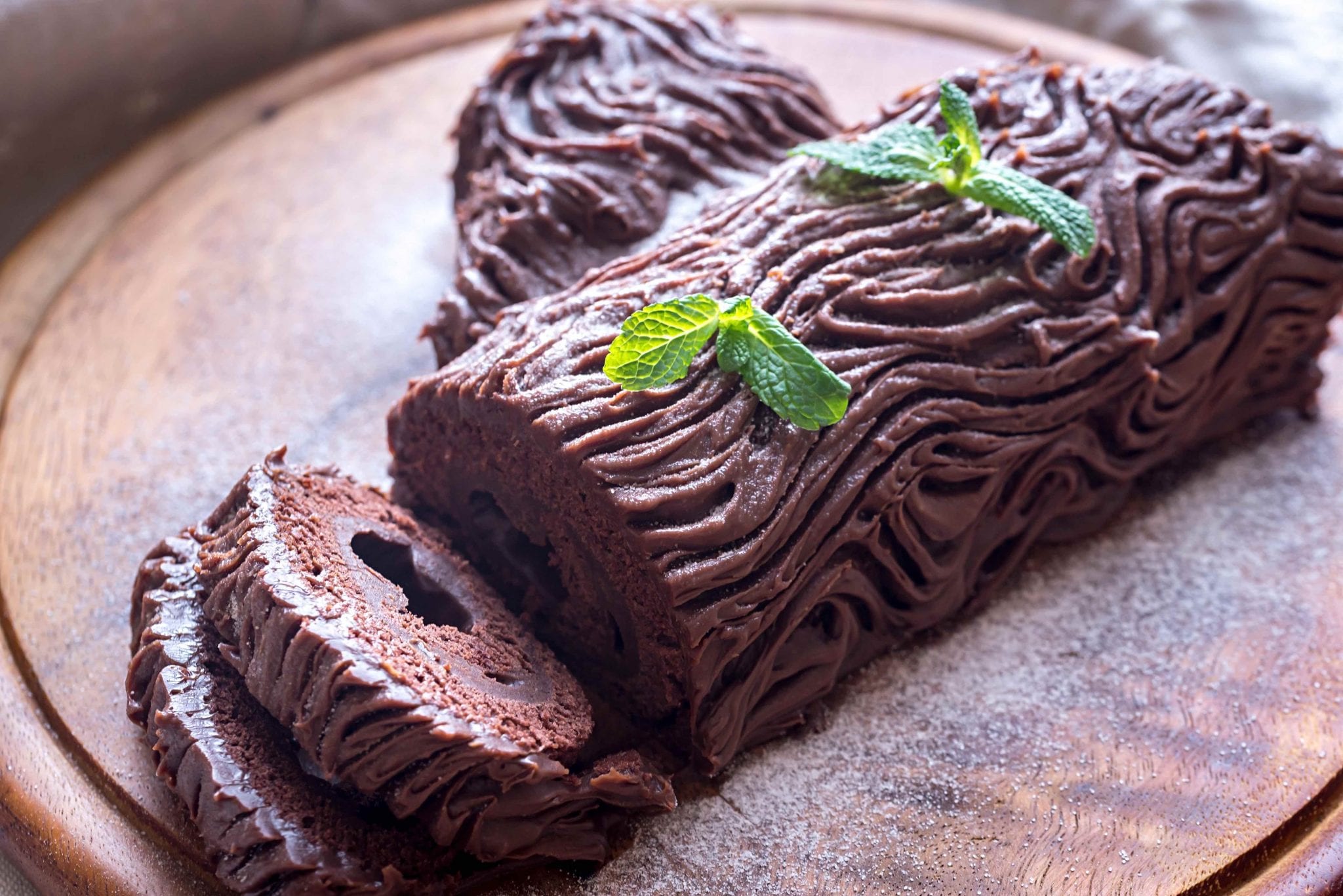 Yule log on the wooden board Source: Stock image