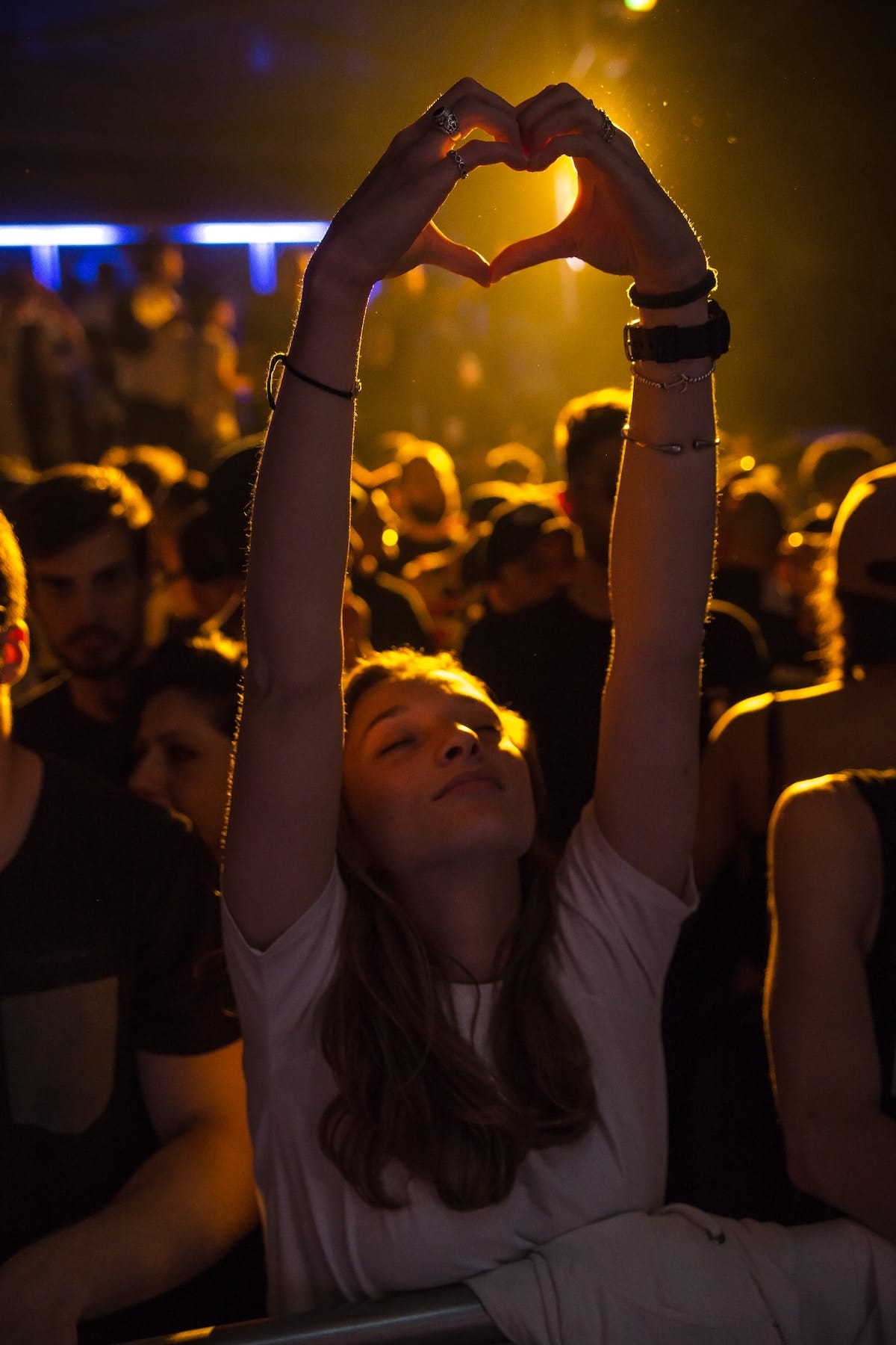 Woman making a heart sign in Italy's festival