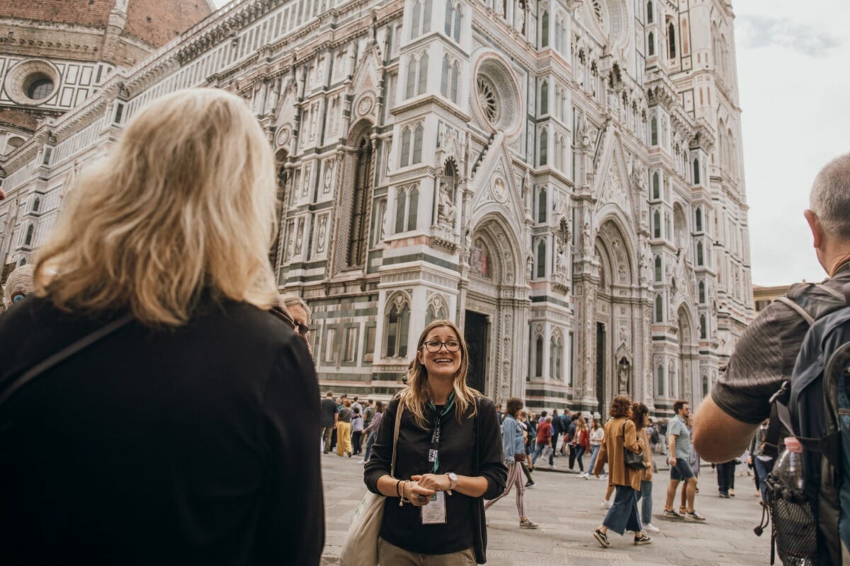 Guide in front of the Florence Duomo explaining to guests about the cathedral
