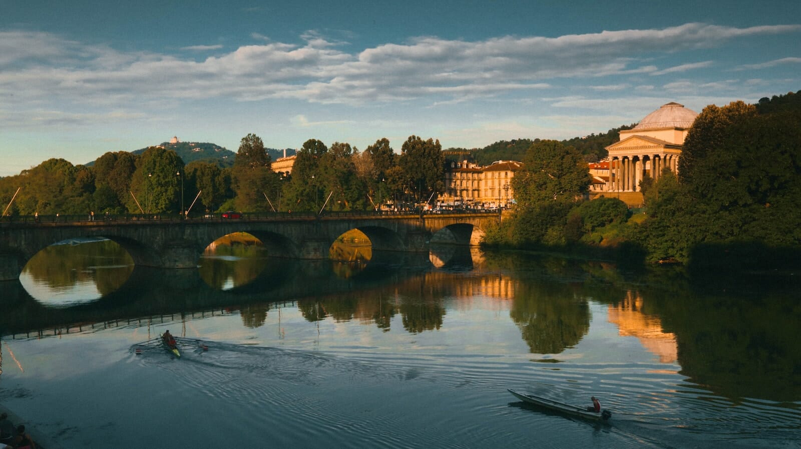 Turin water Po River with monument and boats