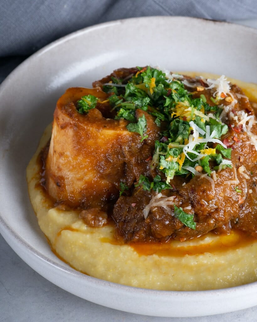 Polenta topped with stewed meat