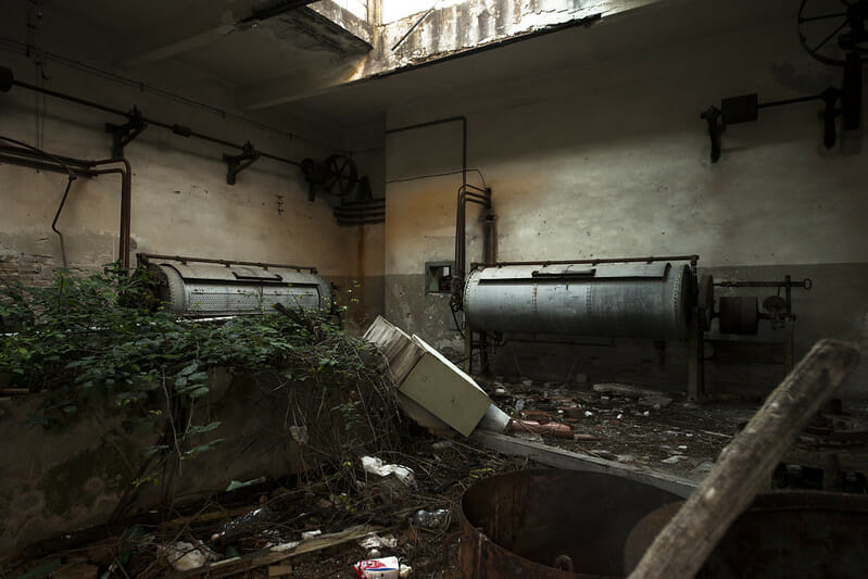 A view inside Poveglia Psychatric Hospital, in Venice, displaying the abandoned elements including some unknown devices and machinery