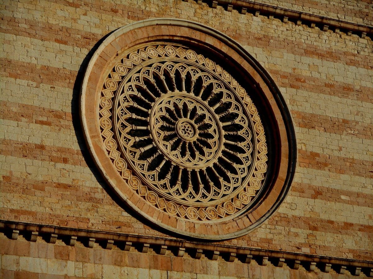 Detailed view of a church window on a wall, with a floral-like pattern