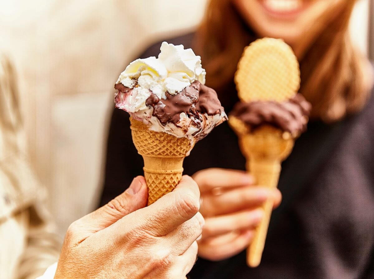 Two people eating gelato in Italy