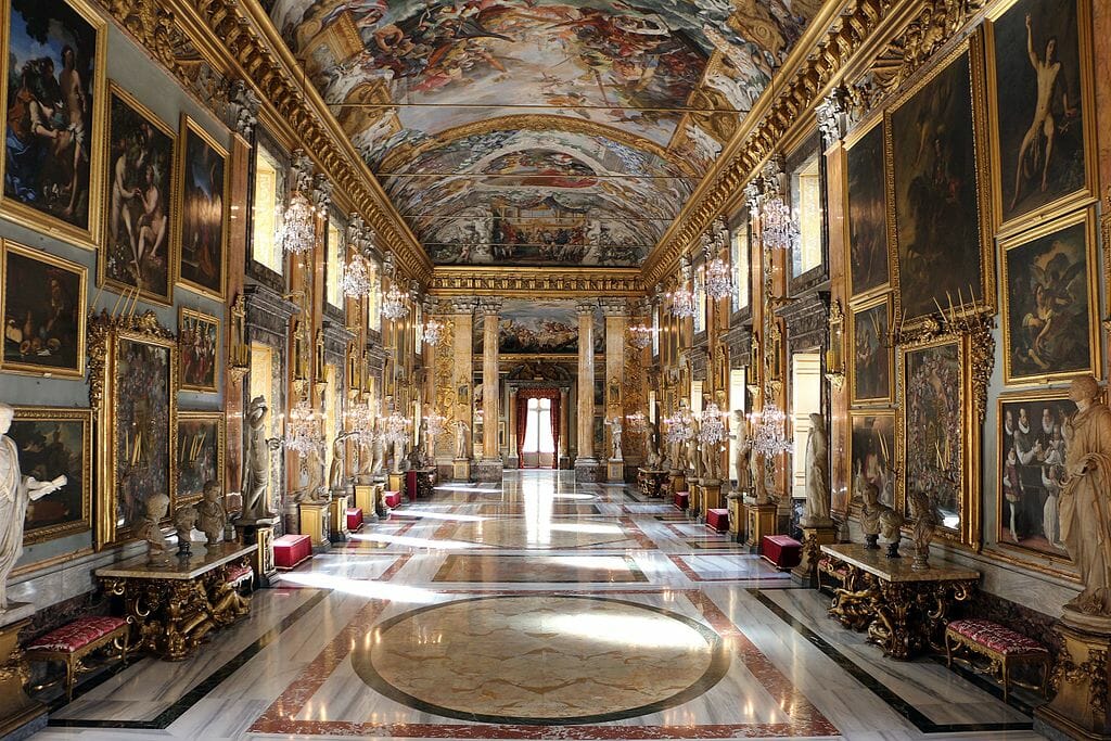Gilded and elaborate hallway lined with paintings at the Palazzo Colonna, or Colonna Palace, in Rome.
