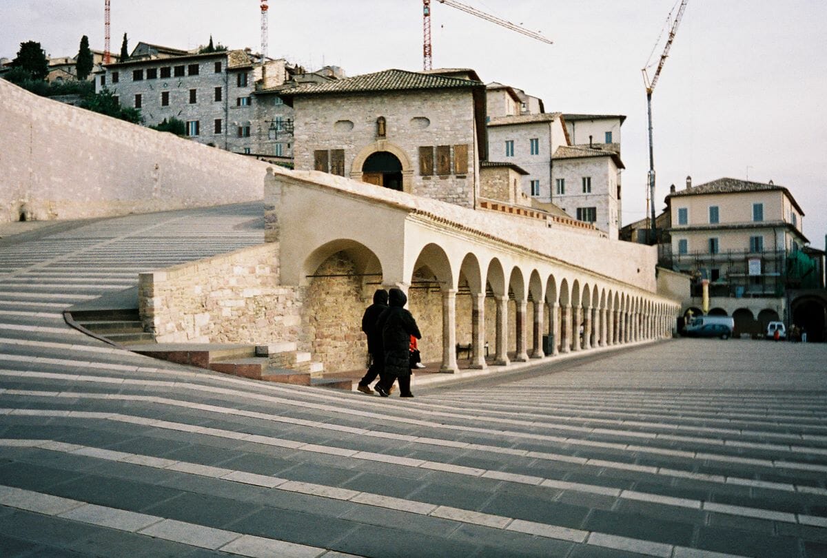 People descending steps in a city