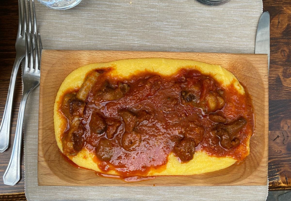 A plate of poletna covered in meat sauce