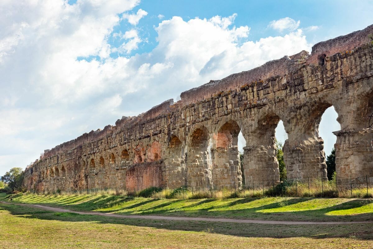 Large wall aqueduct structure in a park in Rome