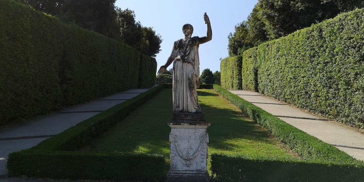 A statue inside a garden