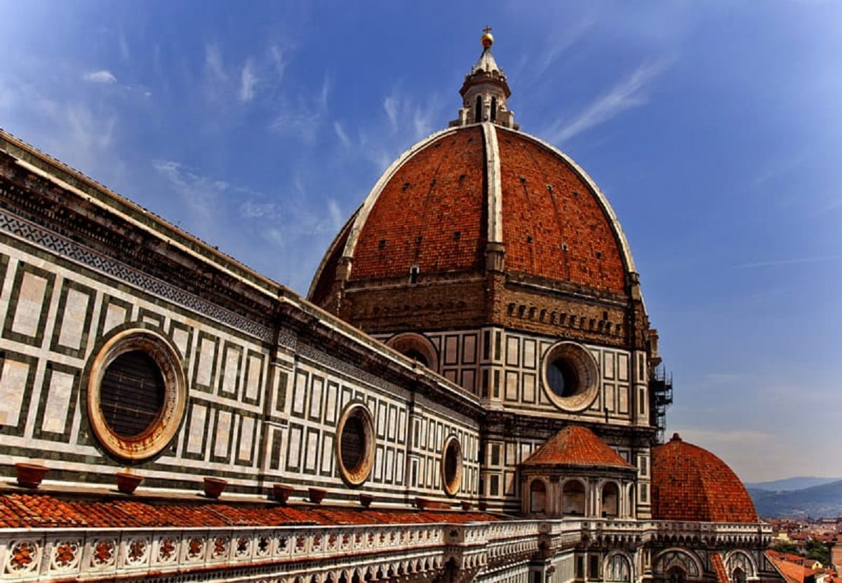 historic building with large red roof dome