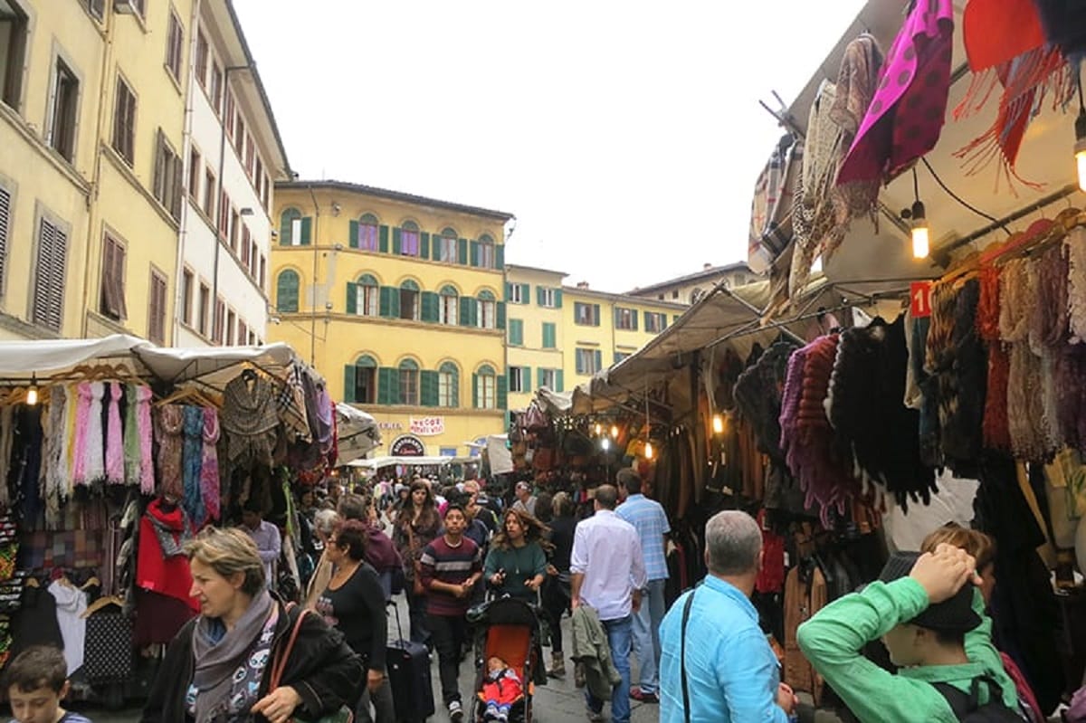 people shopping in a street marking