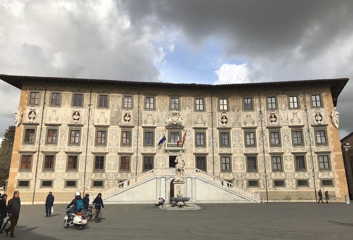 people walking inside a plaza in Pisa