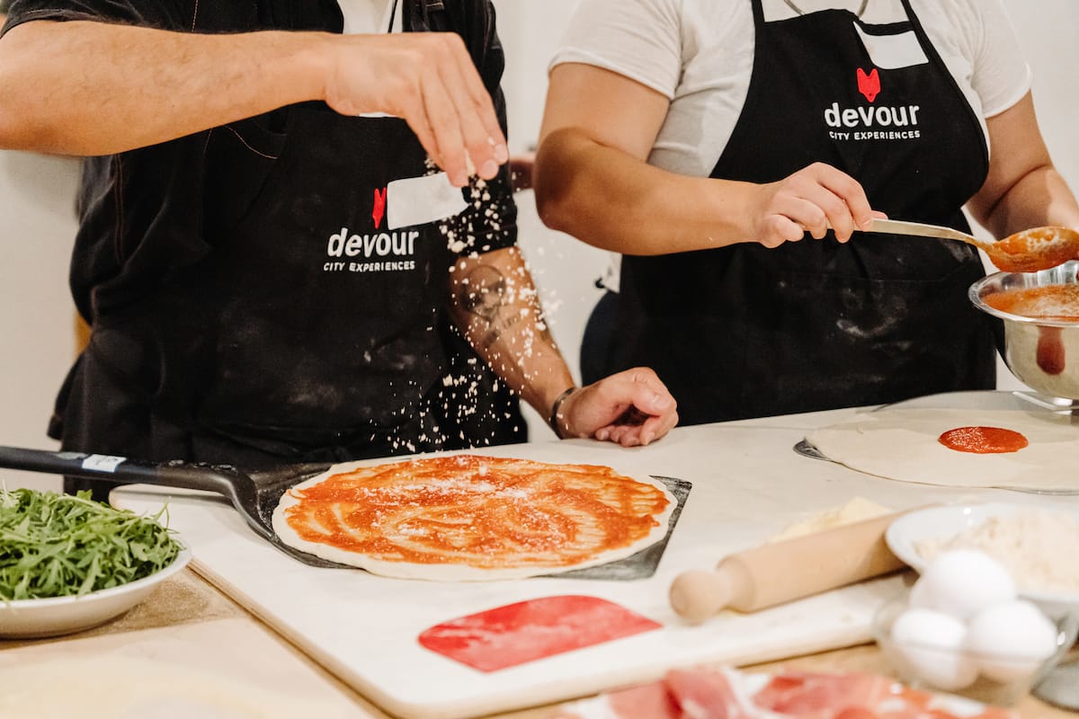 people making pizza