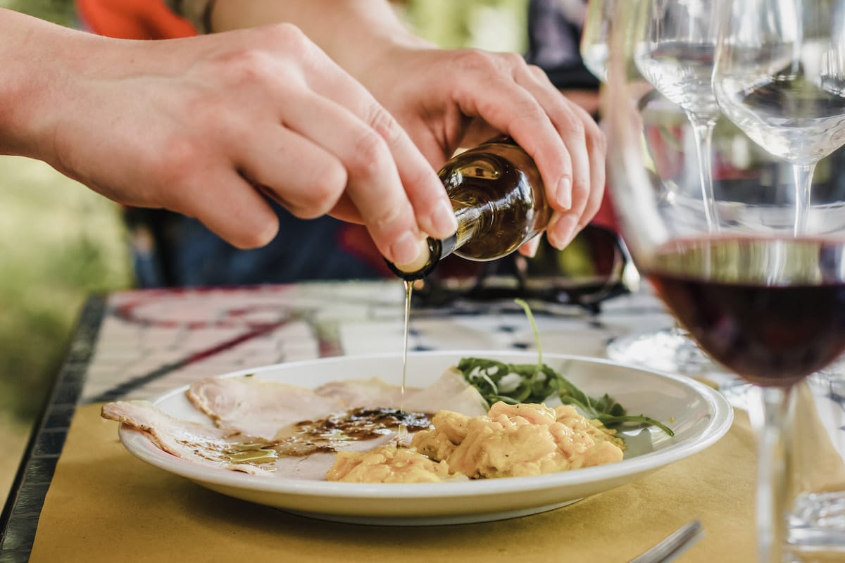 pouring oil on food