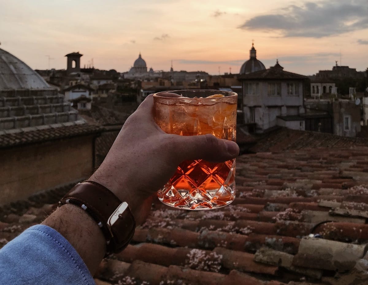 Drinking a cocktail during a sunset in Rome
