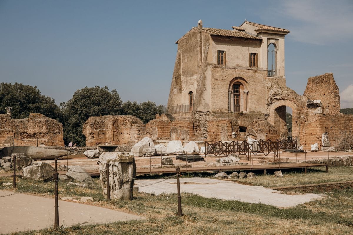 Ancient ruins with large arched doorways that make up the House of Livia.
