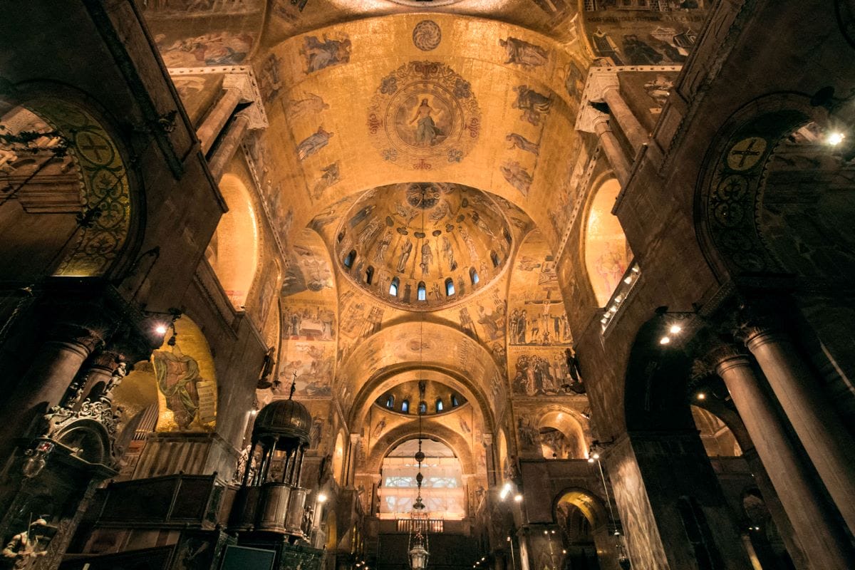 A great way to tour St. Mark’s Basilica is at night when you can see the ornate paintings and frescos illuminated.