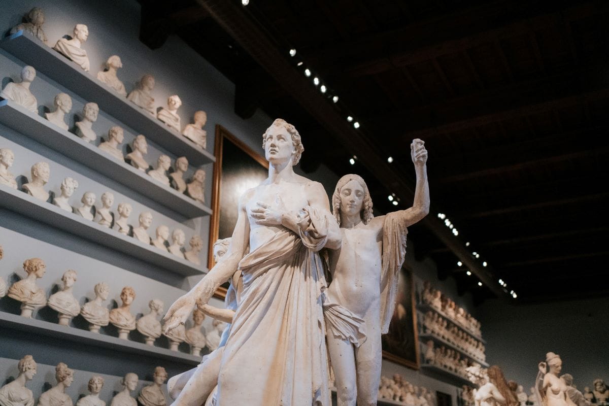 A statue of a man and a young child are part of the infinite number of artworks in Florence.