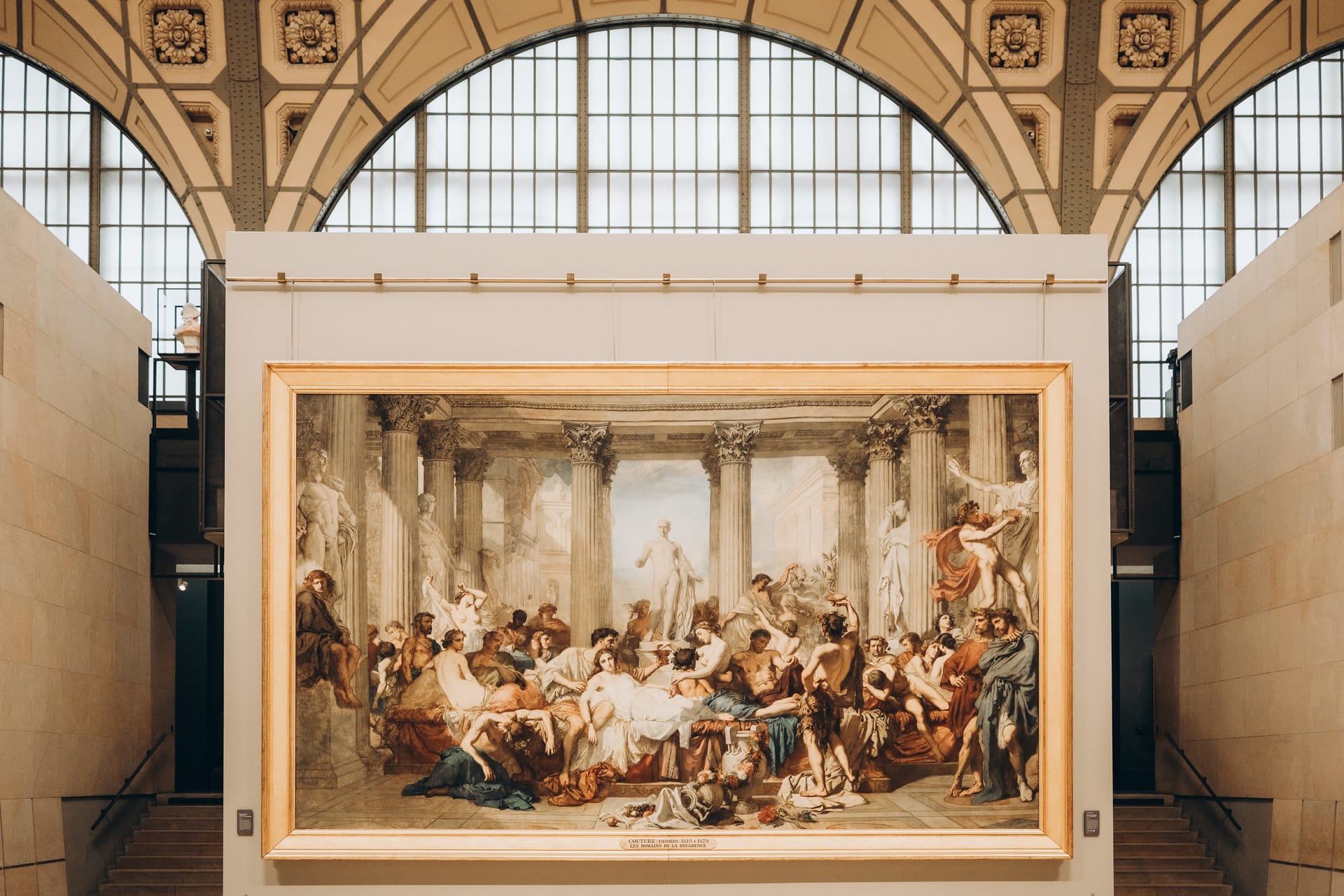 A large historical painting displayed in the Musée d'Orsay with its intricate details.