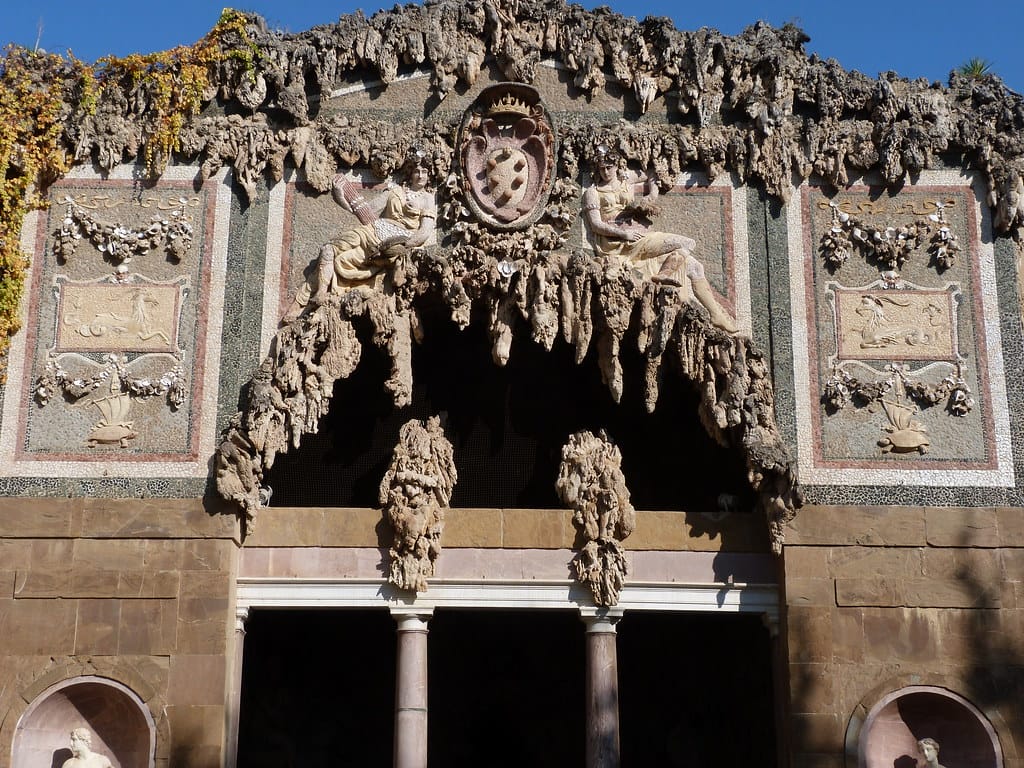 What are the Boboli Gardens best bits? The entrance to grotto grande, with archway and pillars, flanked by high walls and ornate carvings, all covered in strange dripping stone effect